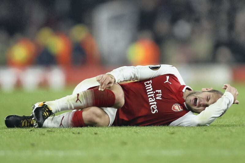 LONDON, ENGLAND - NOVEMBER 02:  Jack Wilshere of Arsenal goes down injured during the UEFA Europa League group H match between Arsenal FC and Crvena Zvezda at Emirates Stadium on November 2, 2017 in London, United Kingdom.  (Photo by Bryn Lennon/Getty Images)