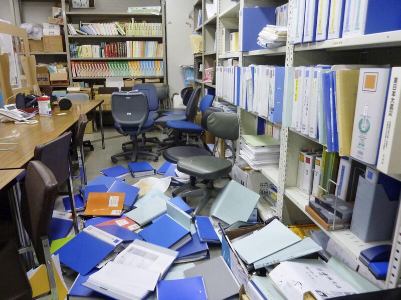 File folders are seen scattered on the floor of the Kyodo News bureau after a strong quake in Sendai, Miyagi Prefecture, Japan, on February 13, 2021. REUTERS