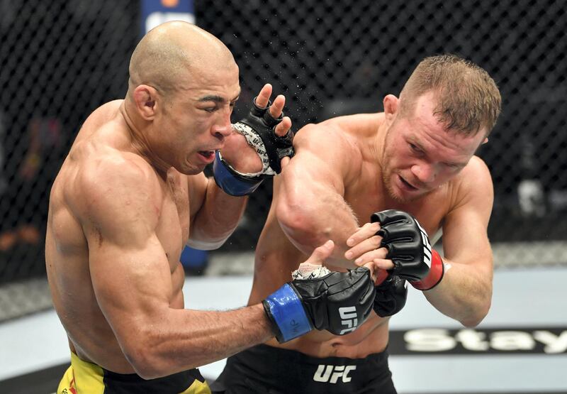 ABU DHABI, UNITED ARAB EMIRATES - JULY 12: (R-L) Petr Yan of Russia elbows Jose Aldo of Brazil in their UFC bantamweight championship fight during the UFC 251 event at Flash Forum on UFC Fight Island on July 12, 2020 on Yas Island, Abu Dhabi, United Arab Emirates. (Photo by Jeff Bottari/Zuffa LLC)