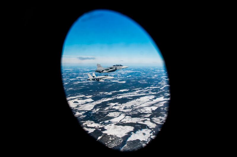 A Swedish Gripen jet and a Finnish F-18 Hornet take part in joint exercises between the two air forces over the Arctic Circle towns of Jokkmokk in Sweden and Rovaniemi in Finland. AFP