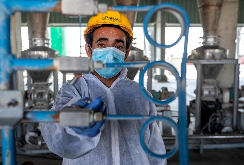 Abu Dhabi, United Arab Emirates, March 29, 2021.   Tadweer’s medical incineration site which has been receiving much more waste over the past year due to Covid-19. --  A plant worker checks a valve at the Incinirator Plant area of the facility.
Victor Besa/The National
Section:  NA
Reporter:  Haneen Dajani