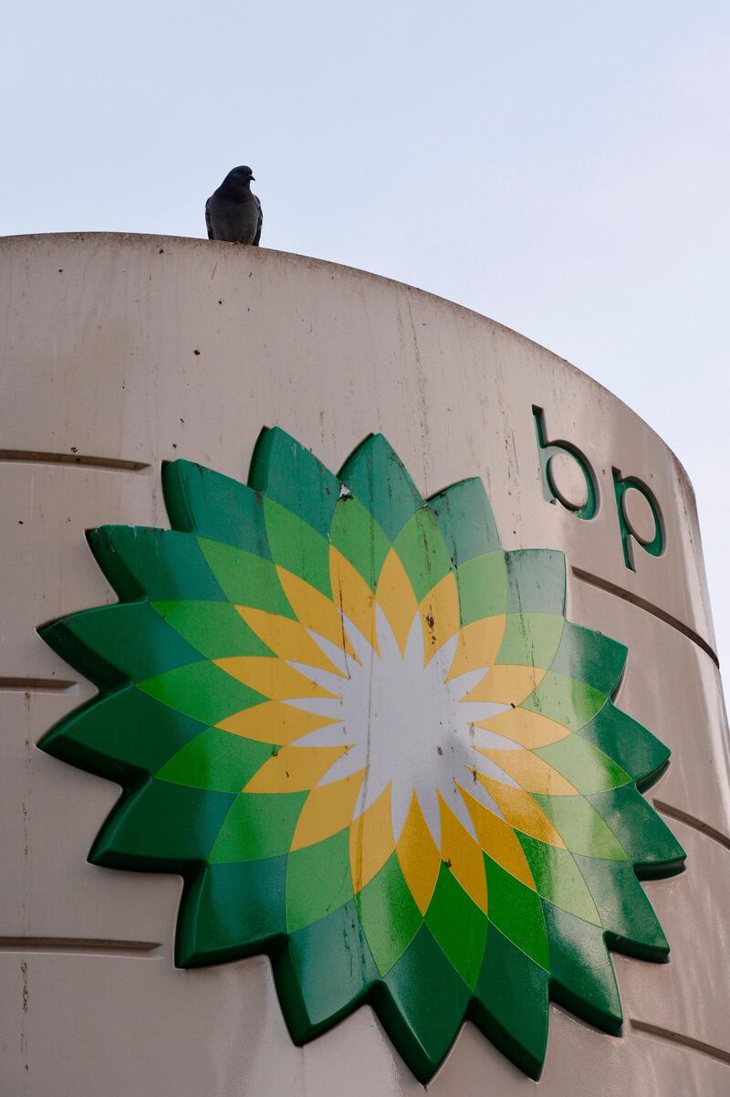 (FILES) This file photo taken on October 30, 2012 shows a pigeon resting on a BP sign outside a filling station in central London.
British energy major BP said January 2, 2018, that it expected to take a 1.5-billion dollar (1.2-billion-euro) hit from US President Donald Trump's tax reforms. / AFP PHOTO / CARL COURT