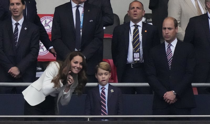 Britain's Catherine, Duchess of Cambridge, Prince George of Cambridge, and Britain's Prince William, Duke of Cambridge, are seen during the Euro 2020 final football match between Italy and England at Wembley Stadium.