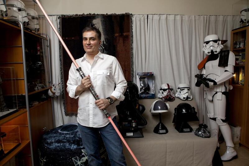 Omar Al Bahiti with some of his Star Wars memorabilia at his home in Dubai. Christopher Pike / The National
