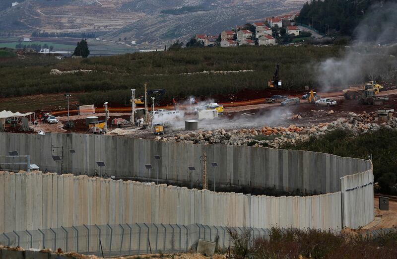 Israeli military equipment works on the Lebanese-Israeli border. AP Photo