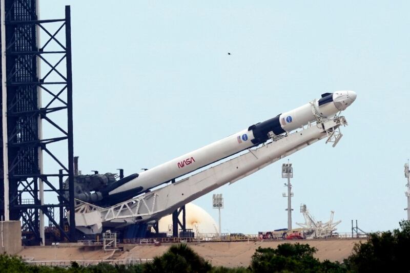 The rocket is raised into position. AP Photo