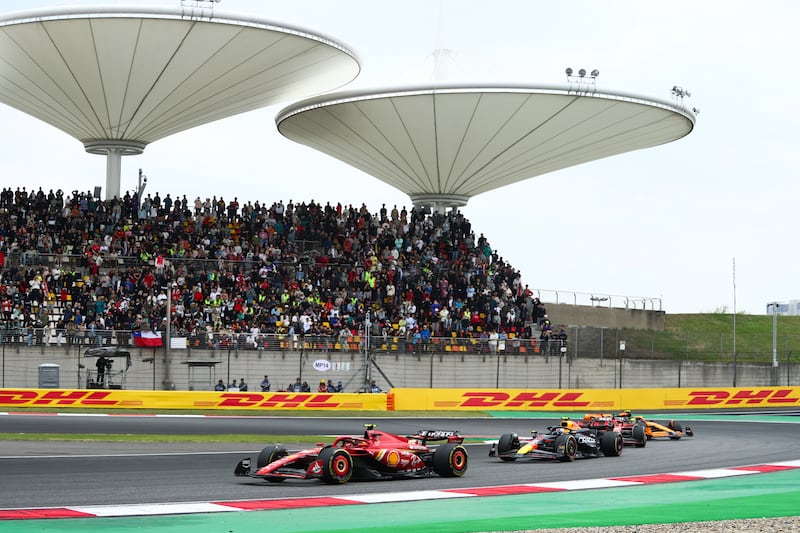 Carlos Sainz of Ferrari and Spain leads Sergio Perez of Red Bull during the sprint race for the Chinese GP. Getty Images
