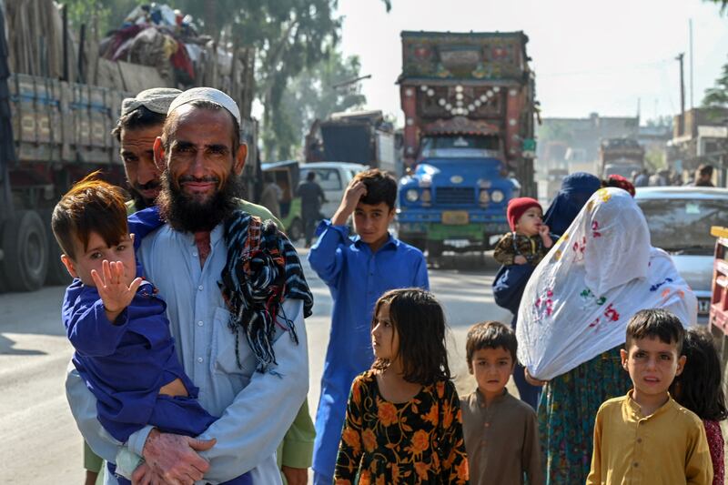 An Afghan refugee family living in Pakistan arrive at the UN High Commissioner for Refugees repatriation centre, near Peshawar. AFP