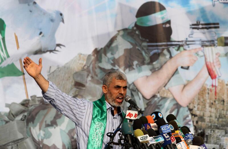 File - In this Friday, Oct. 21, 2011 file photo, Yehiyeh Sinwar, a founder of Hamas' military wing, talks during a rally in Khan Younis, southern Gaza Strip, . Sinwar left for talks with Egyptian officials Thursday after a new outbreak of violence, as Hamas accuses Israel of slowing down the implementation of Egyptian-mediated understandings aimed at easing the situation in the Palestinian enclave and paving the way for a cease-fire. (AP Photo/Hatem Moussa, File)