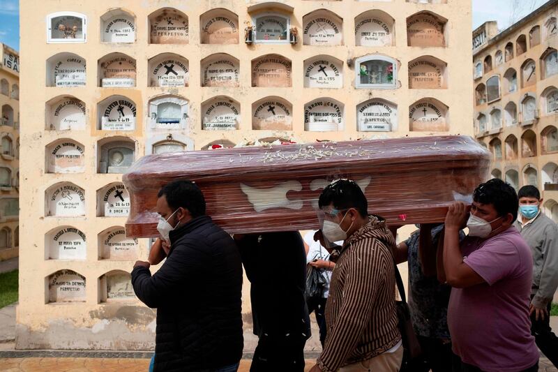 Relatives of a Covid-19 victim carry a coffin at the General Cemetery in the central city of Huanuco, 370 kilometers northeast of Lima. Sixteen million Peruvians will enter a two-week coronavirus lockdown covering a third of the country at the end of January, Peru's interim president said Tuesday. The South American nation's healthcare system has been overwhelmed by the Covid-19 pandemic, with only 500 intensive care beds for a population of 32 million, with authorities reporting a spike in deaths as infections increase. AFP