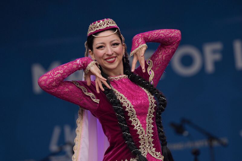 A performer takes part in the Uzbek Cultural Showcase, part of Cultural Style Week, during Eid at Trafalgar Square in London. AP