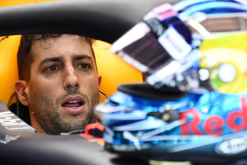 Red Bull Racing's Australian driver Daniel Ricciardo sits in his car in the pits during the third practice session at the Monaco street circuit on May 26, 2018 in Monaco, ahead of the Monaco Formula 1 Grand Prix. / AFP / Boris HORVAT                        
