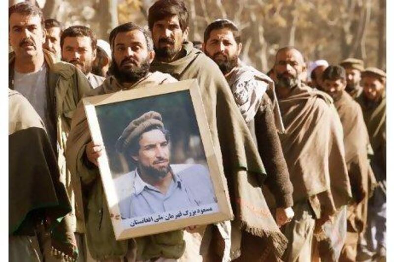 Ahmad Shah Masoud's supporters pay tribute to him a month after suspected Al Qaeda operatives had him assassinated. Jimin Lai / AFP