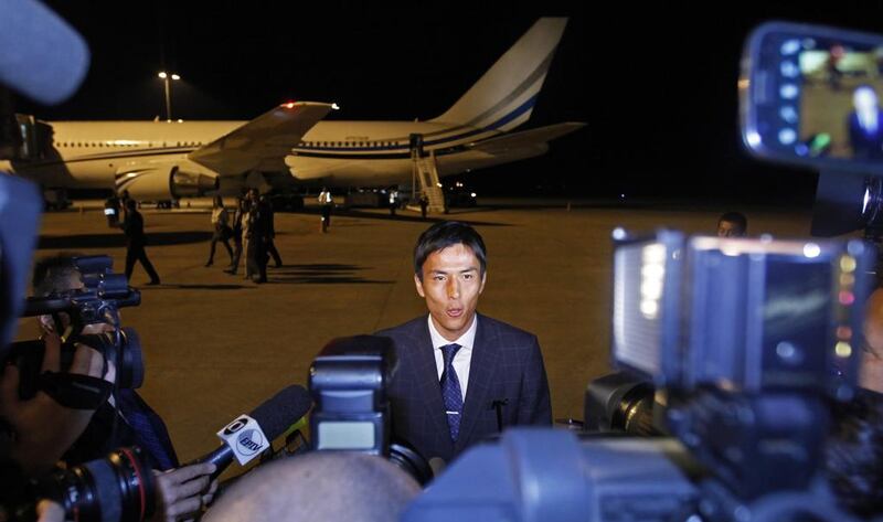 Japan captain Makoto Hasebe speaks to reporters as his team arrives at Viracopos Airport in Campinas, north of Sao Paulo, on June 7, 2014. Shuji Kajiyama / AP Photo