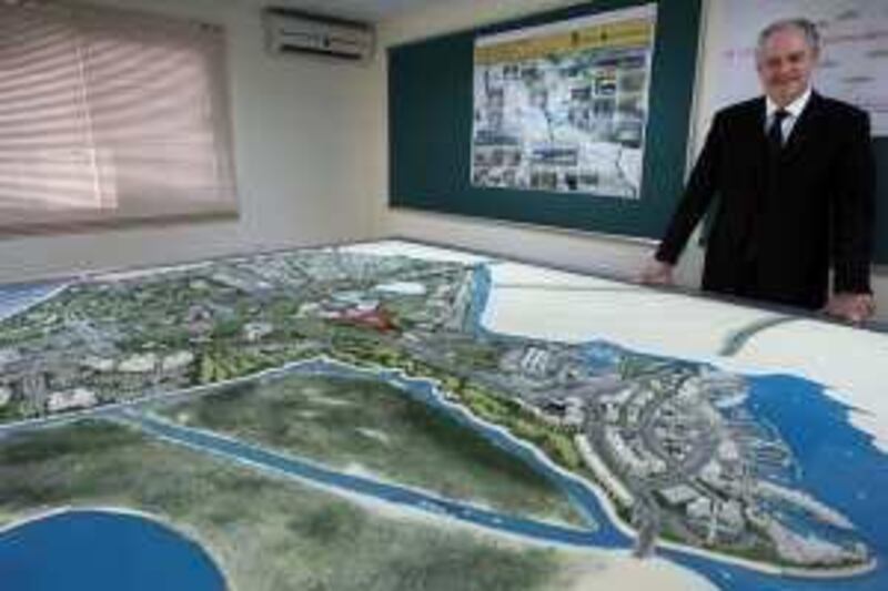 ABU DHABI. 22nd July 2009. Richard Cregan, CEO of Abu Dhabi Motorsports Management at his office on Yas Island yesterday(weds) with a model of the Yas Island development Stephen Lock  /  The National .  *** Local Caption ***  SL-cregan-004.jpg