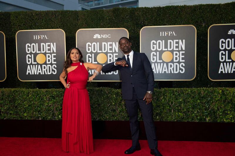 Salma Hayek, in Alexander McQueen, and Sterling K Brown attend the 78th annual Golden Globe Awards in Beverly Hills, California, on February 28, 2021. AFP