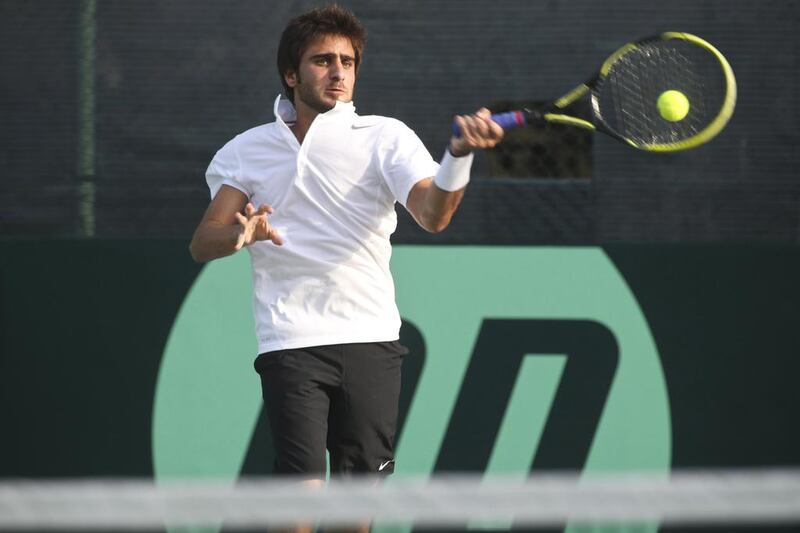 The UAE's Hamad Janahi defeated Cambodian player Panhara Mam, who was forced to retire due to cramping, in their Davis Cup qualifier match at Dubai on Thursday. Razan Alzayani / The National