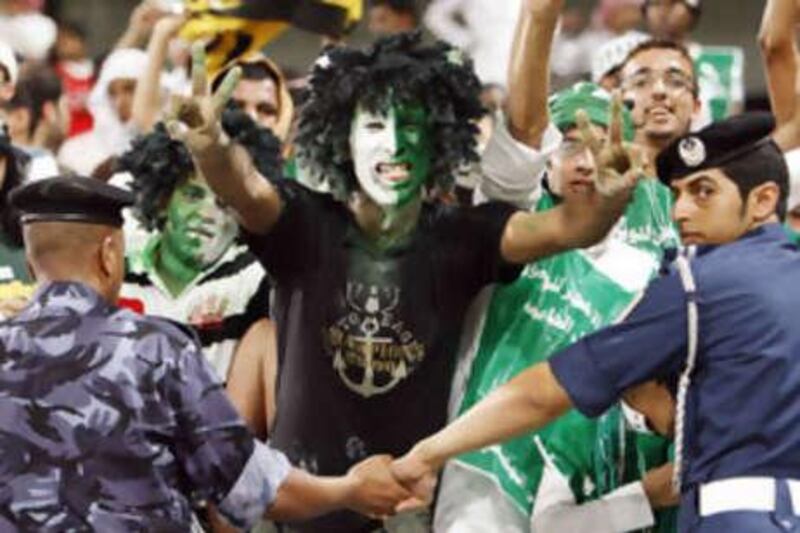 Saudi fans celebrate during the World Cup 2010 qualifying soccer against the UAE, in Abu Dhabi on Sept 10 2008.