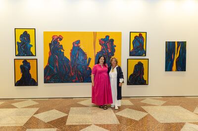 Cultural Foundation director Reem Fadda, left, and artist Hind Nasser, right, at 'Fahrelnissa and the Institutes: Towards a Sky'. Photo: The Culture Foundation