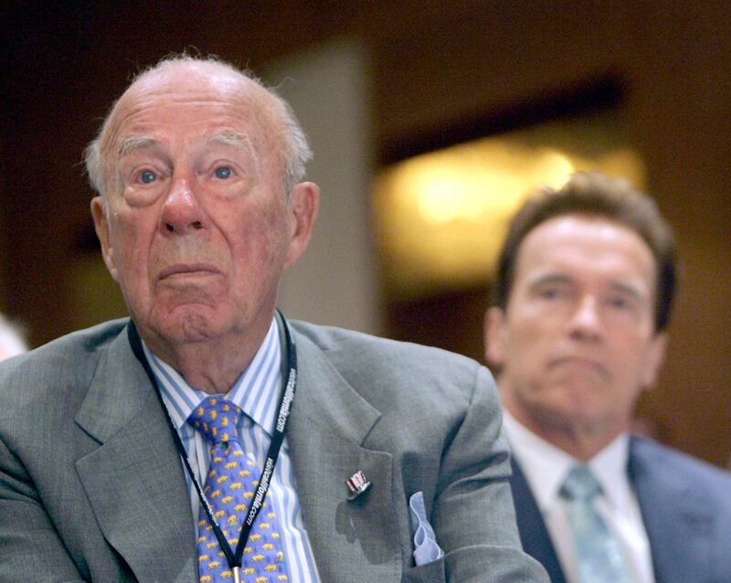 George Shultz and California Governor Arnold Schwarzenegger listen during the opening of the 26th Border Governors Conference  in Los Angeles on August 14, 2008. AP