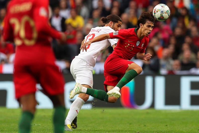 Switzerland's Ricardo Rodriguez (C) in action against Portugal's Joao Felix (R) during the UEFA Nations League semi final.  EPA