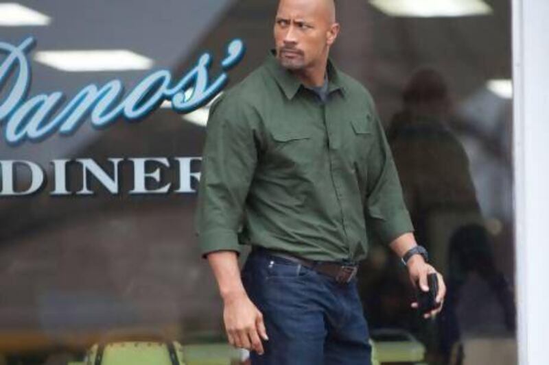 Dwayne Johnson plays a blue collar father forced to infiltrate a drug cartel. Steve Dietl / Summit Entertainment