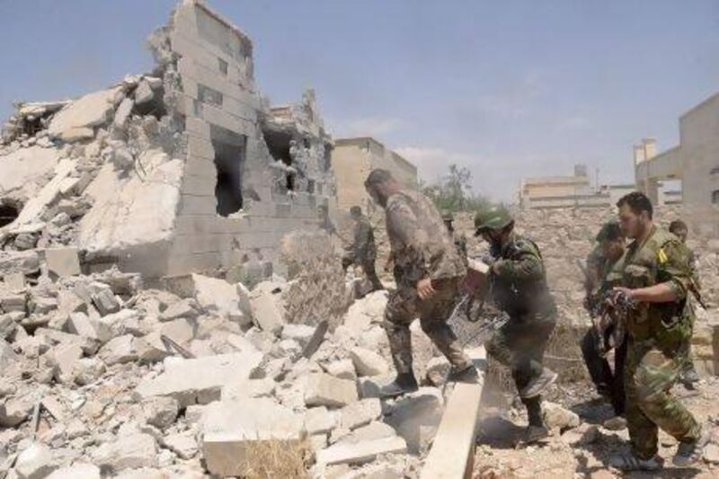 Syrian regime forces during an operation to push rebels from a road between Dahra Abd Rabbo village and Castello in Aleppo.