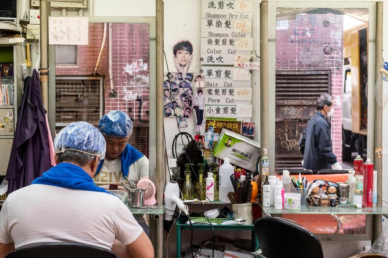 At a street hairdresser in Hong Kong, China, December 8. EPA