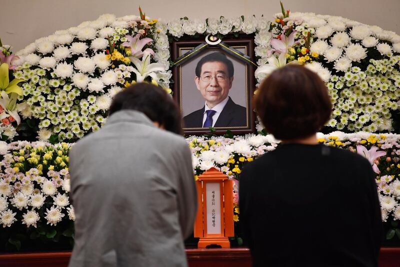 In this photo provided by Seoul Metropolitan Government, a portrait of the deceased Seoul Mayor Park Won-soon is placed at a hospital in Seoul, South Korea, Friday, July 10, 2020. Park left a note saying he felt â€œsorry to all peopleâ€ before he was found dead early Friday, officials in the South Korean capital said as people began mourning the liberal legal activist seen as a potential presidential candidate. (Seoul Metropolitan Government via AP)