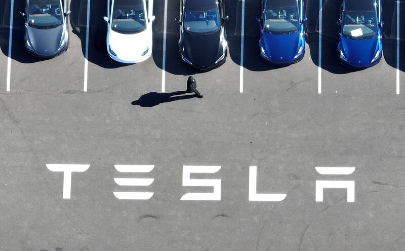 New Tesla cars sit in a car park at the Tesla factory in Fremont. Getty / AFP