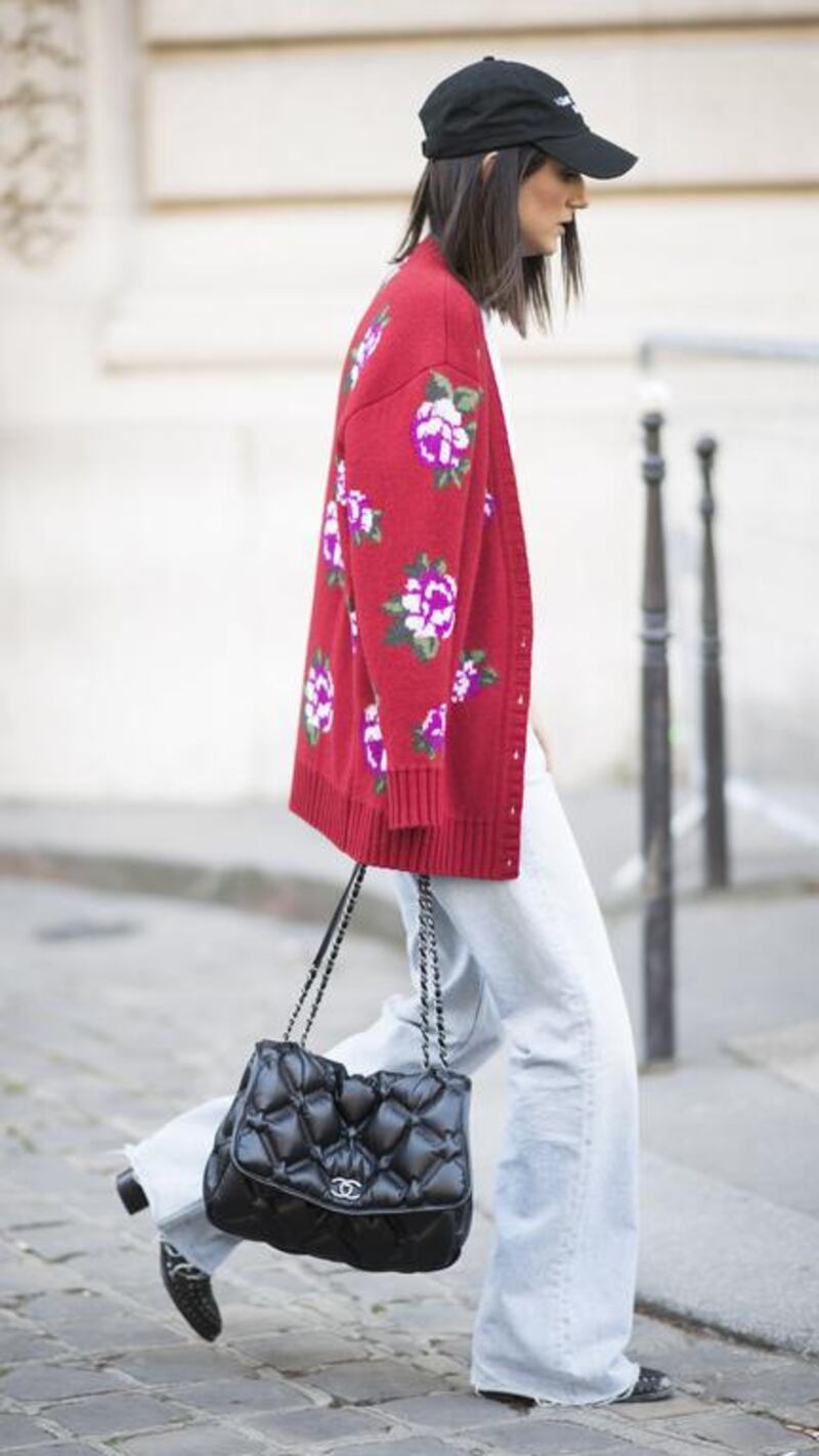 The cardigans currently in vogue aren’t fitted, flimsy numbers, but oversized, knitted and embroidered. Timur Emek / Getty Images