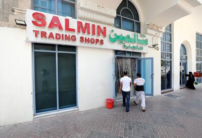Abu Dhabi, United Arab Emirates - July 30, 2019: People shop at Salmin Trading Shops to go with a story about Ihram's which is worn on Hajj. Monday the 30th of July 2019. Downtown, Abu Dhabi. Chris Whiteoak / The National