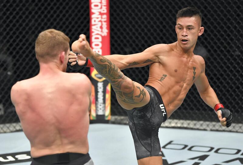 ABU DHABI, UNITED ARAB EMIRATES - JULY 12: (R-L) Martin Day kicks Davey Grant of England in their bantamweight fight during the UFC 251 event at Flash Forum on UFC Fight Island on July 12, 2020 on Yas Island, Abu Dhabi, United Arab Emirates. (Photo by Jeff Bottari/Zuffa LLC)