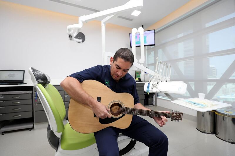 Abu Dhabi, United Arab Emirates - April 23, 2019: Tarek Al Khatib, a dentist who decided to learn to play guitar at age 41. Tuesday the 23rd of April 2019. Twofour54, Abu Dhabi. Chris Whiteoak / The National