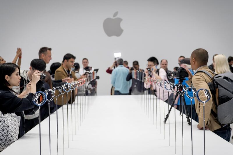 Attendees view Apple watch series 4 devices displayed during an Apple Inc. event at the Steve Jobs Theater in Cupertino, California, U.S., on Wednesday, Sept. 12, 2018. Apple Inc. took the wraps off a renewed iPhone strategy on Wednesday, debuting a trio of phones that aim to spread the company's latest technology to a broader audience. Photographer: David Paul Morris/Bloomberg