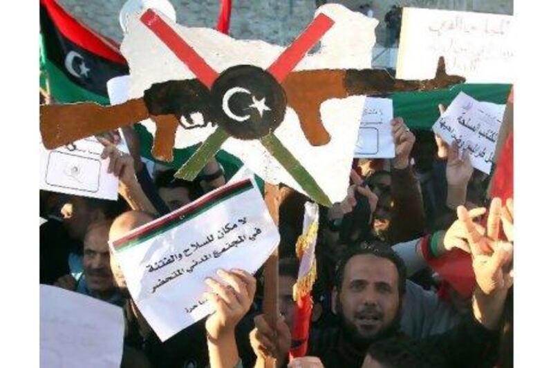 Libyans gather in Tripoli on Thursday to call on the interim government to take control of the problem of illegal weapons.