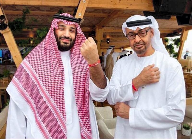 Sheikh Mohamed bin Zayed and Saudi Arabia's Crown Prince Mohammed bin Salman wear the Special Olympics wrist band during the Formula E race in Riyadh. Courtesy Special Olympics World Games Abu Dhabi Twitter