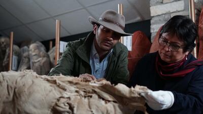 Ramy Romany talking with Sonia Guellen over a Mummy in Mummies Unwrapped. Courtesy Discovery