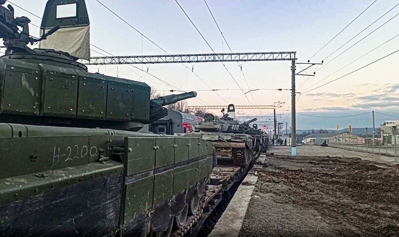 Russian armoured vehicles are loaded on to railway platforms after the end of military drills in southern Russia. AP Photo