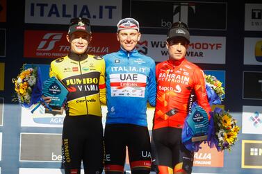 (L-R) Second placed Danish rider Jonas Vingegaard of team Jumbo-Visma, first placed Slovenian rider Tadej Pogacar of UAE Team Emirates and third placed Spanish rider Mikel Landa of Bahrain-Victorious team pose on the podium after the 7th and final stage of the Tirreno-Adriatico cycling race, over 159km with start and finish in San Benedetto del Tronto, Italy, 13 March 2022.   EPA / ROBERTO BETTINI