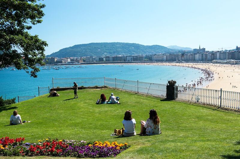Locals and visitors enjoy a glorious summer day at the Miramar Palace Gardens, open to the public. Soak in the views of the beaches and all the way to both hills on either side of the city.