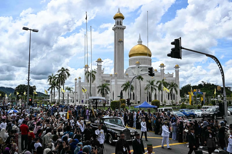 Crowds of thousands turned out to see the newlywed couple. AFP 