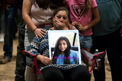 Esmeralda Bravo, 63, sheds tears while holding a photo of her granddaughter, Nevaeh, one of the Robb Elementary School shooting victims. AP