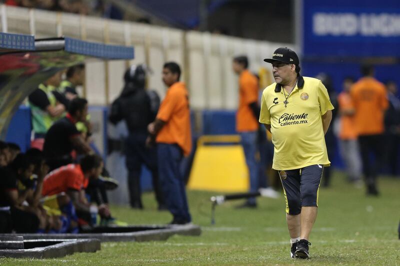 Maradona walks on the sideline. Getty Images