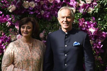 Former British prime minister Tony Blair (R) and his wife Cherie Blair (L) pose for photographs as they arrive to attend the wedding ceremony of Akash Ambani, son of Indian Businessman Mukesh Ambani, in Mumbai on March 9, 2019. AFP