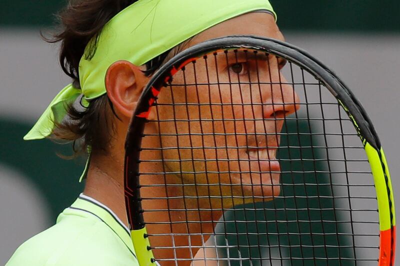 Nadal grimaces after a point against Federer. AP Photo