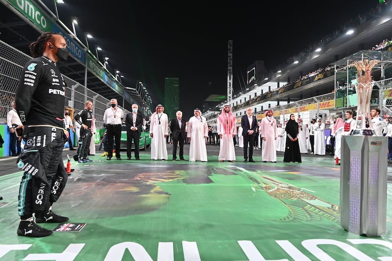 Lewis Hamilton looks at the trophy prior to the start of the Formula One Saudi Arabian Grand Prix. AP