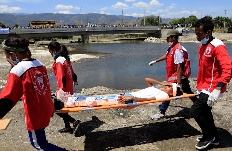 Red Cross volunteers participate during an earthquake and tsunami drill