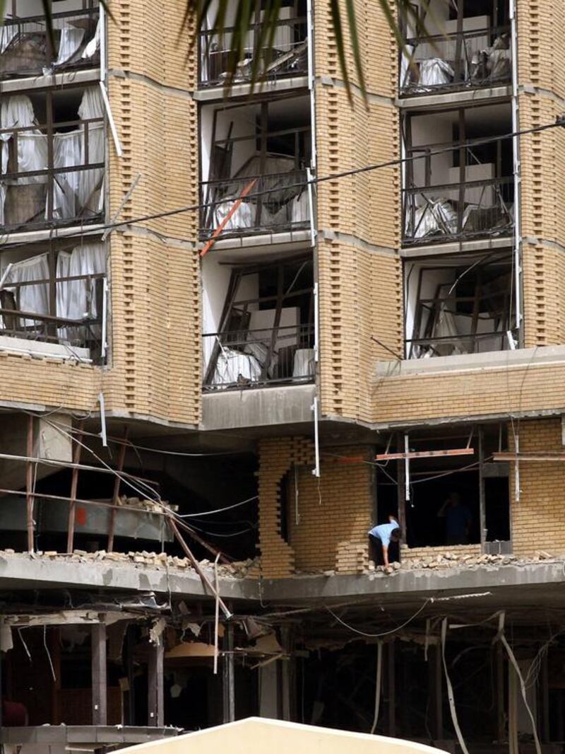 Militants were able to bring the bombs, which exploded just before midnight (11pm) on Thursday and were heard across the city centre, inside the walled compounds of the Ishtar and Babylon hotels in central Baghdad. Ali Abbas / EPA