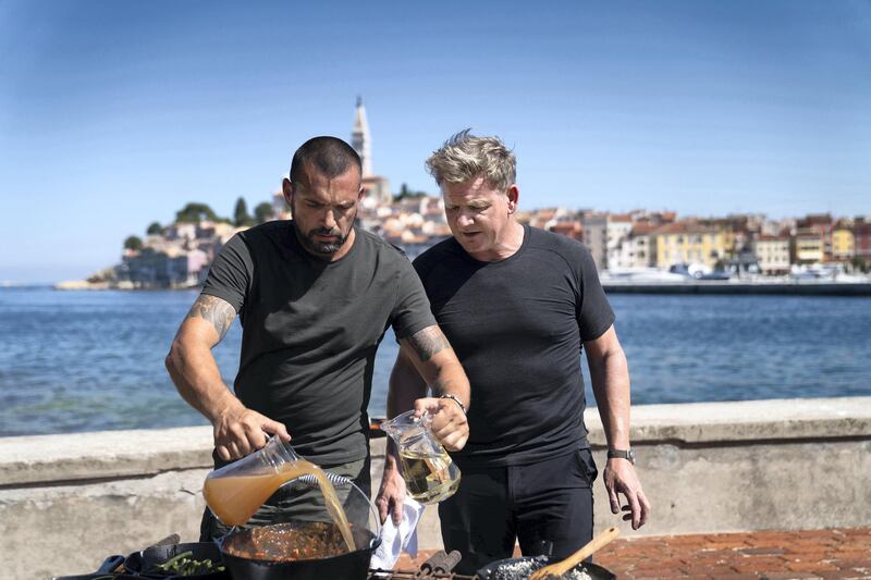 Croatia - Gordon Ramsay (R) stands by as Croatian chef David Skoko works on his spider crab and conger eel stew during the final cook. (Credit: National Geographic/Justin Mandel)